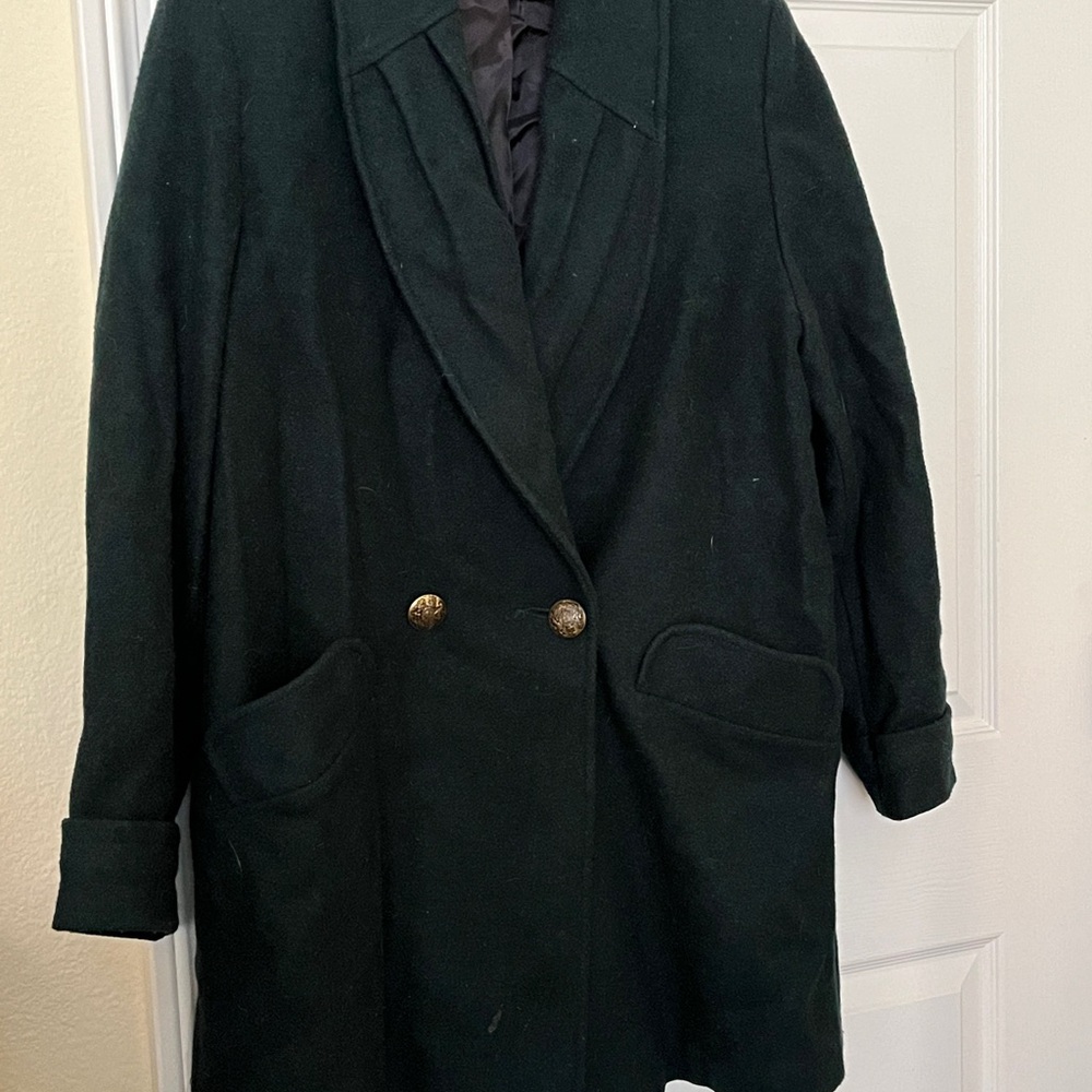 Green woolly coat with double buttons.
